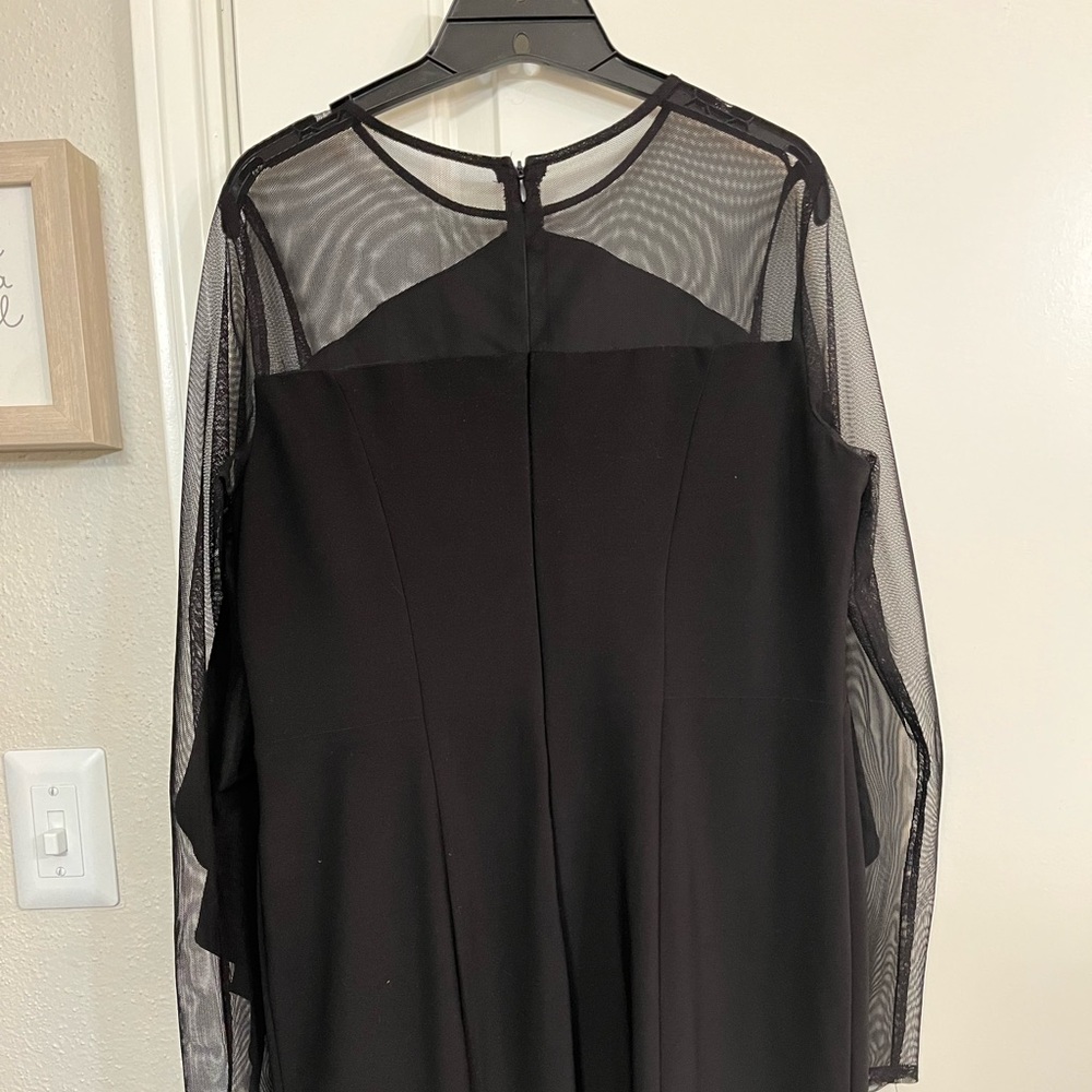 Black, sheer, and ruffle dress. Size 12 fits below the knee.